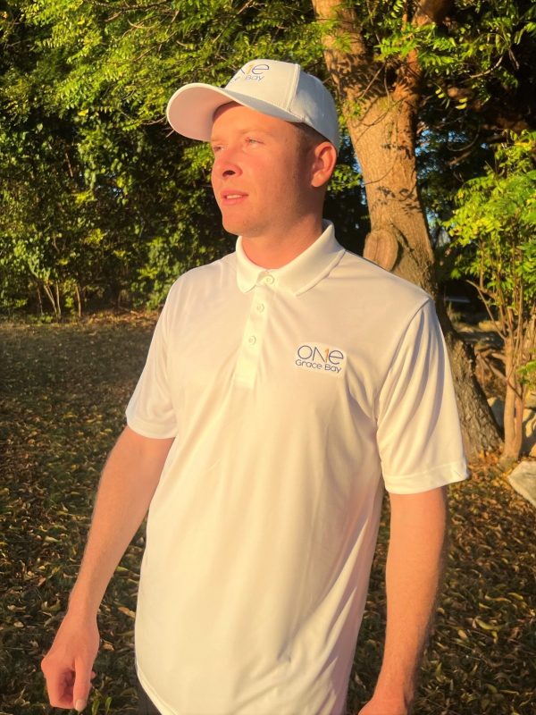 man wearing one grace bay golf shirt